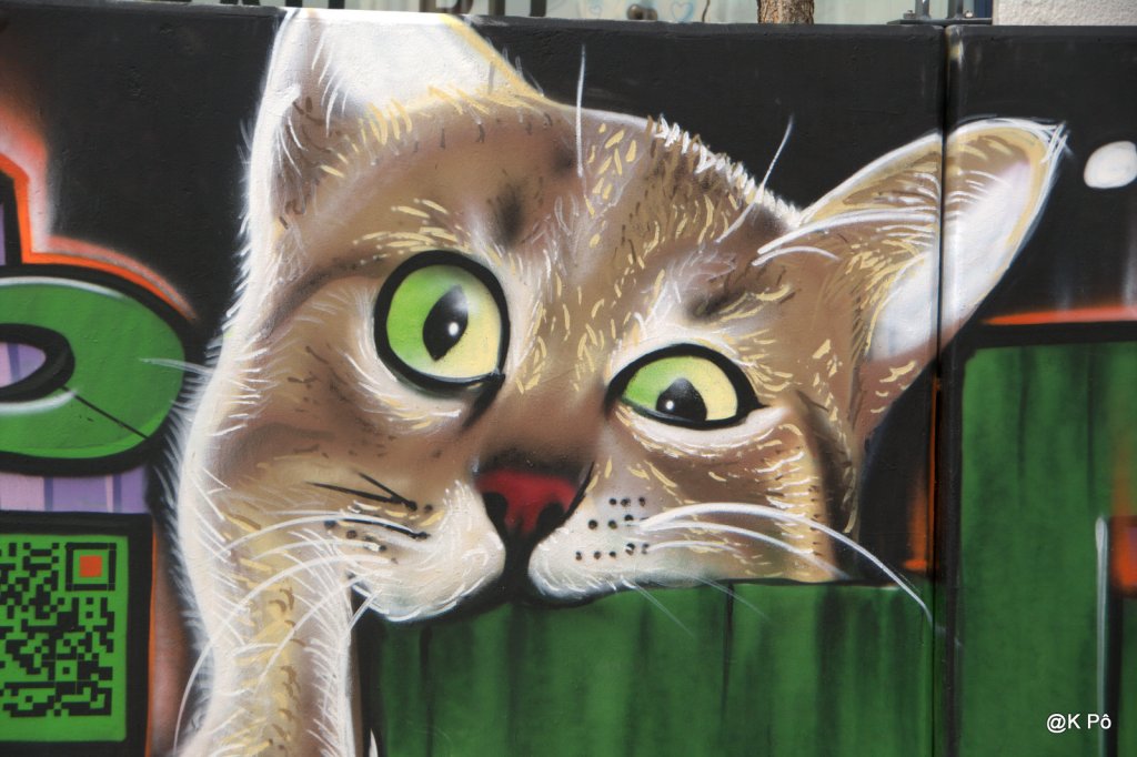 les facéties d’un gros matou , (rejeton du chat du Cheshire de Lewis Caroll)